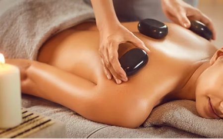 Unwind with the Healing Touch of Hot Stone Massage Therapy at Wellness Massage & Aesthetics Spa
